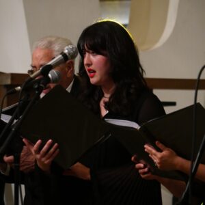 A member of the choir performs during a concert.