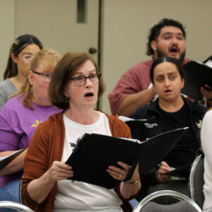 Female singers rehearsing.