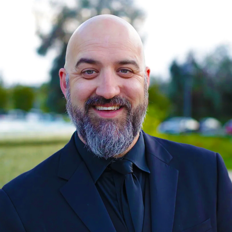 Portrait of Dr. Brian Dehn in a nature setting.